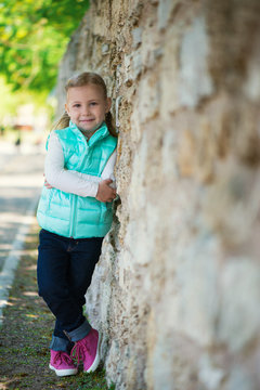 Pretty little girl standing in park