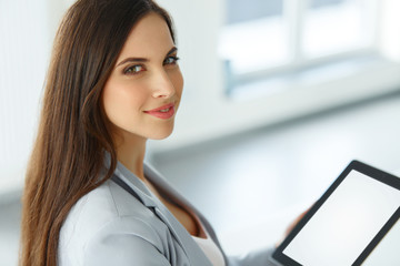 Tablet computer. Business woman with digital tablet computer