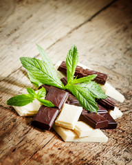 Delicious white and dark chocolate with mint, selective focus
