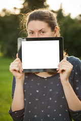 Young woman using tablet outdoor