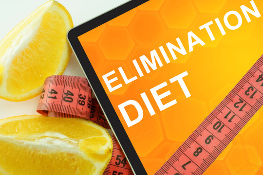 Elimination Diet On Tablet. Fat Lost Concept. 