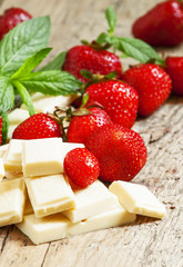 Delicious white chocolate with strawberries and mint, selective