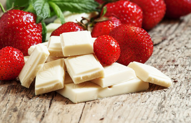 Delicious white chocolate with strawberries and mint, selective