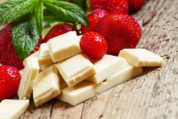 Delicious white chocolate with strawberries and mint, selective