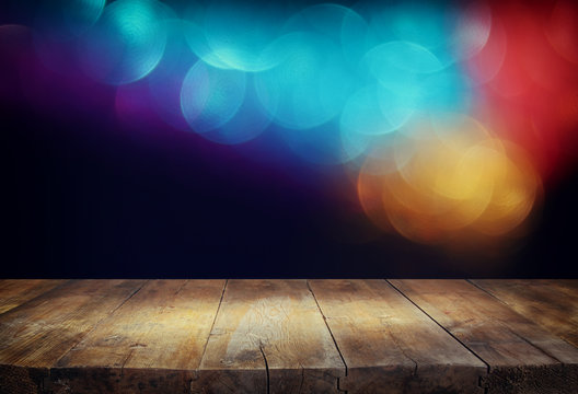 wood boards and dark glitter bokeh lights background