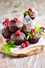 Chocolate muffins with fresh raspberries for breakfast. Selectiv