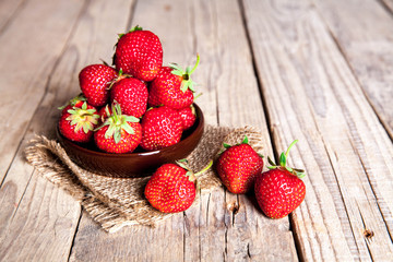 fruit. Fresh strawberries on old wooden background