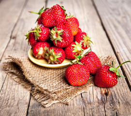 fruit. Fresh strawberries on old wooden background