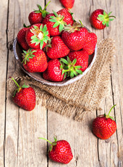 fruit. Fresh strawberries on old wooden background