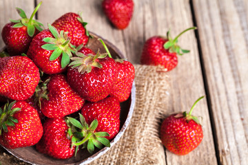 fruit. Fresh strawberries on old wooden background