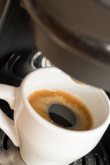 cup of espresso / a cup of espresso is brewed