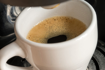 cup of espresso / a cup of espresso is brewed