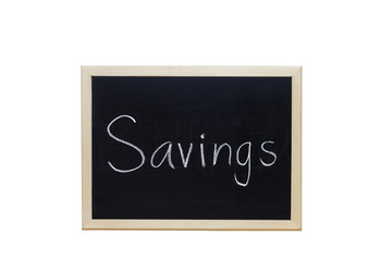 Obraz premium Savings written with white chalk on blackboard.