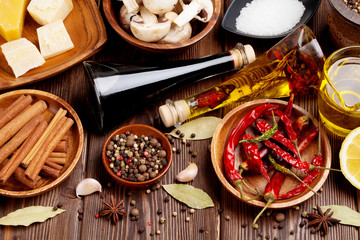 Various spices on wooden background