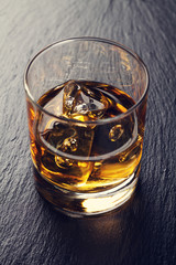 Glass of scotch whiskey with ice