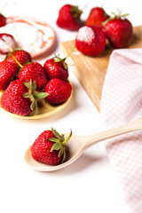 Beautiful strawberries with powdered sugar and tea towels. fruit