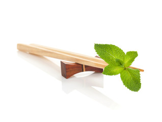 Sushi chopsticks with mint leaves