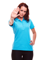 Young woman makes a gesture stop