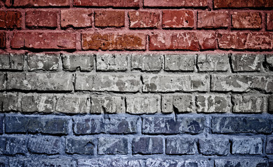 Netherlands flag painted on old brick wall texture background 