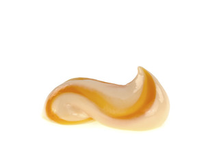 Orange toothpaste drop over white