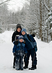 Fototapeta na wymiar three children outdoors in the snow