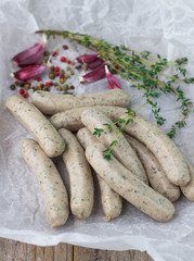 Raw sausages for frying with spices and garlic