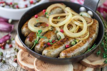 Fried sausages with spices and onions