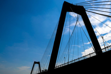 Rotterdam bridge silhouette in blue sky