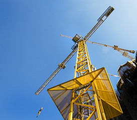 Towering yellow construction crane