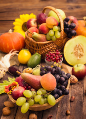Naklejka na ściany i meble Fresh autumn fruits in the basket