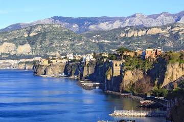 Landscape of the Sorrento town nea Naples, one of the most beautiful places of the Amalfi coast, with sea foreground and mountains background 