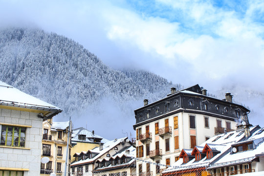 Chamonix town with snowy mountains on the background. Chamonix-Mont-Blanc was the site of the first Winter Olympics in 1924 and it's one of the oldest ski resorts in France. 