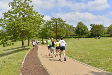 Naklejka premium Course de jogging au parc de Louvain-la-Neuve