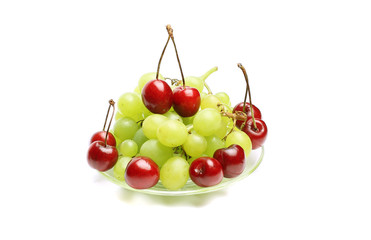 cherry, bunch of grapes on white background