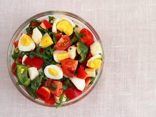 Fresh summer salad in bowl. Top view.