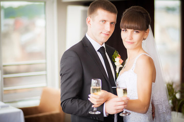 Charming bride and groom on their wedding celebration in a luxur