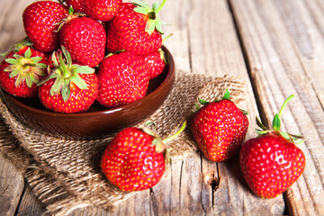 fruit. Fresh strawberries on old wooden background