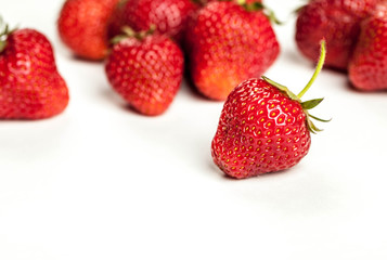 fresh organic strawberry over white background. fruit