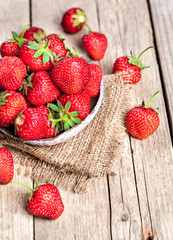 fruit. Fresh strawberries on old wooden background