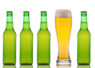 Four Green Beer Bottles and Full Glass