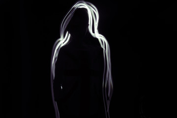 Shadow Girl - A silhouette of a girl on a black background. Glow white-purple line is around her.