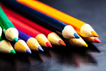 Obraz premium Colour pencils isolated on black background close up