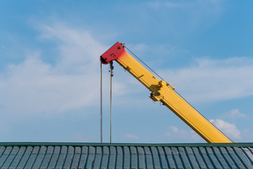 Jib of auto crane above the roof