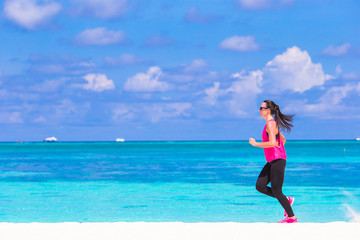 Healthy athlete woman working out doing exercise on tropical