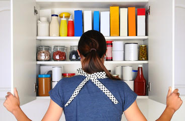 Woman Opening Full Pantry