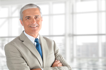 Senior Businessman Arms Folded