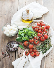 Basil, cherry-tomatoes, mozarella, olive oil,  salt, spices on