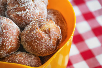 Freshly baked donuts in bowl