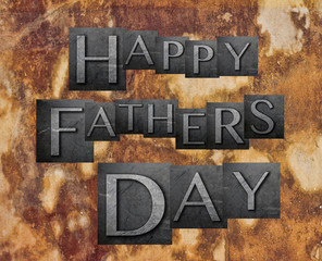 Happy Fathers Day letters over stone
