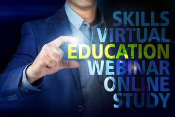 Businessman presses button  education on virtual screens. Busine